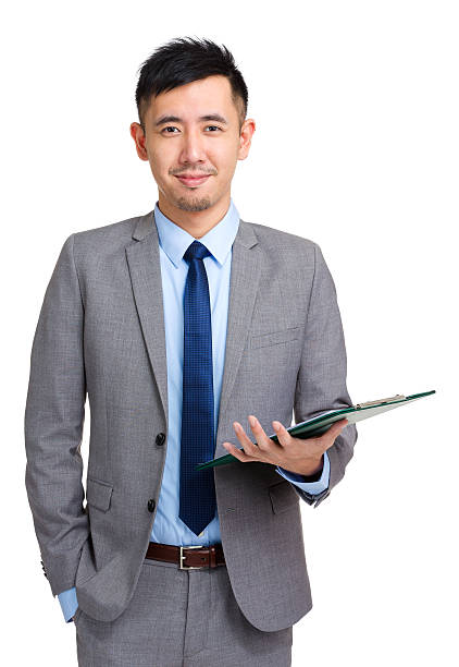 istock Chinese businessman holding a clipboard 599992936