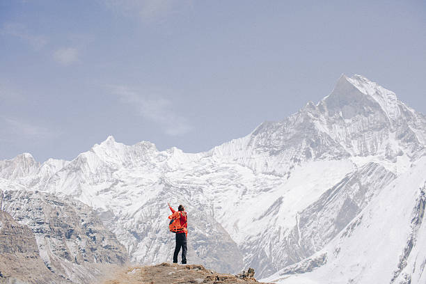 Photo of a proud hiker who has conquered one of the mountains of Annapurna Range on Himalayas, Nepal