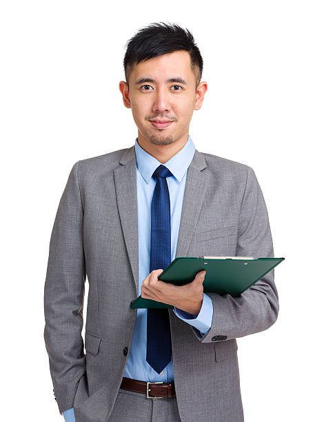 istock Chinese businessman holding a clipboard 599992988
