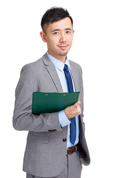 istock Chinese businessman holding a clipboard 599993026