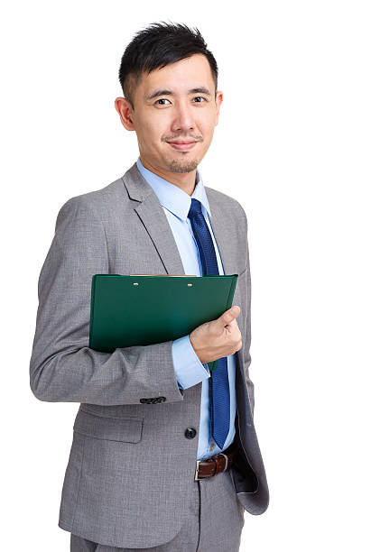 istock Chinese businessman holding a clipboard 599993104
