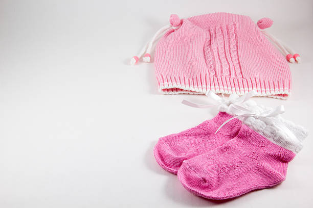 istock Baby hat and booties on a white background 599995198