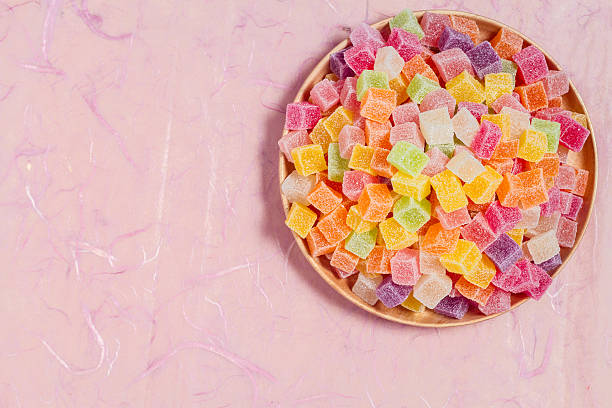 istock Candy and jelly colorful in dish on pink background 599995558