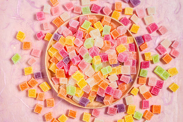 istock Candy and jelly colorful in dish on pink background 599995852