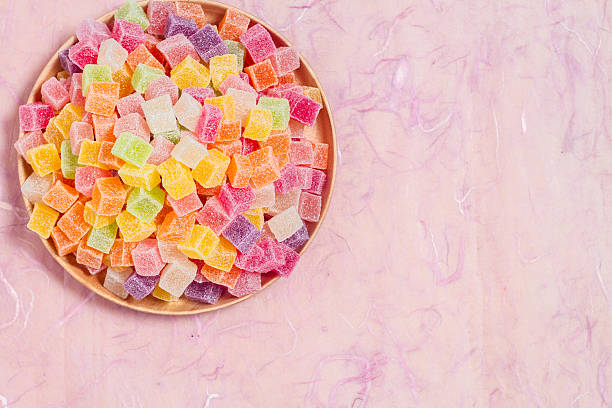 istock Candy and jelly colorful in dish on pink background 599996240