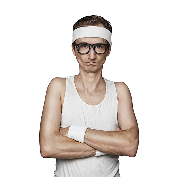 Funny sport nerd Funny sport nerd pretending tough guy isolated on white background slim stock pictures, royalty-free photos & images