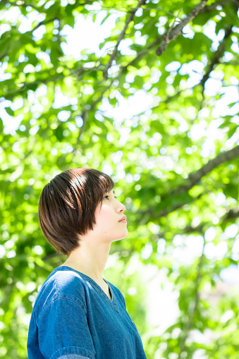 Japanese young woman portrait in the fresh green.