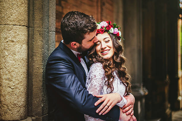 istock Groom and bride near the columns 599997034