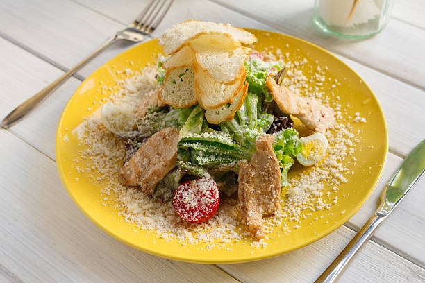 istock Restaurant food closeup. Caesar chicken salad with parmesan 599998352