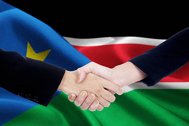 istock Negotiation handshake with flag of South Sudan 599998486