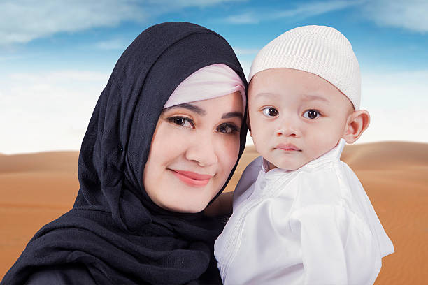 istock Arabic woman and her son at desert 600000020