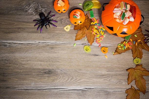 istock Halloween Jack o Lantern pail overflowing with candy 600000322