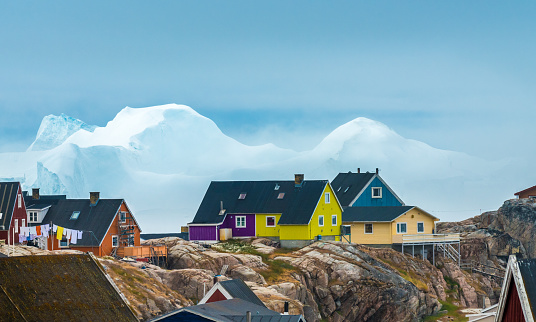 The city of Iulissat with stranded icebergs in the background, Greenland