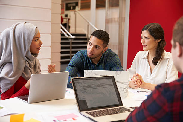 Group Of Students Meeting For Tutorial With Teacher Group Of Students Meeting For Tutorial With Teacher hijab stock pictures, royalty-free photos & images