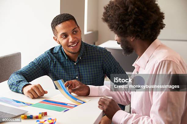 Tutor Using Learning Aids To Help Student With Dyslexia Stock Photo - Download Image Now