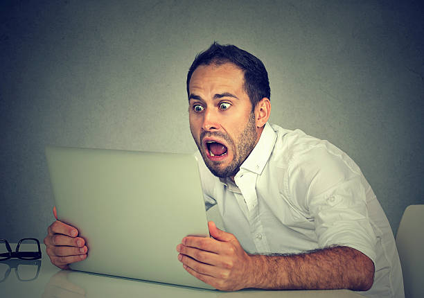 Shocked Computer Nerd Shocked And Surprised Boy On The Internet With Laptop Computer Stock ...