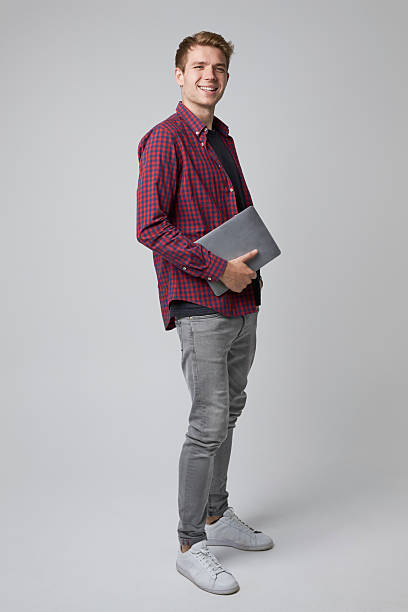 istock Studio Portrait Of Casually Dressed Businessman With Laptop 600057450