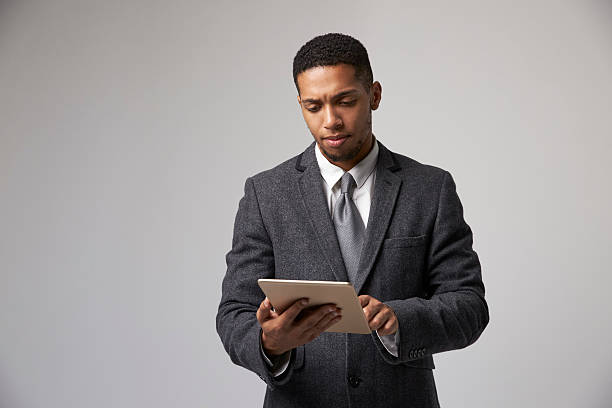 istock Studio Portrait Of Businessman Using Digital Tablet 600057766
