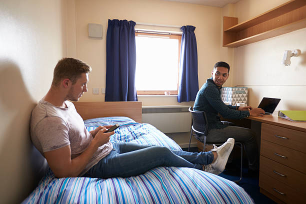 istock Male Students Working In Bedroom Of Campus Accommodation 600057888