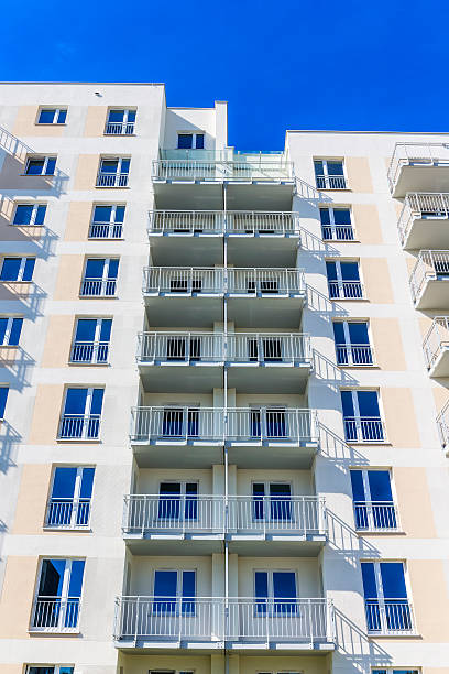 istock Balconies in white modern apartment building 600059224
