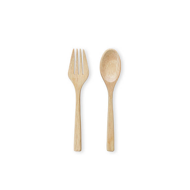istock Top view bright wooden spoon and fork isolated on white 600059286
