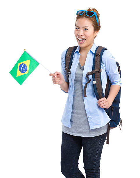 istock Traveller with backpack waving Brazilian flag 600059292
