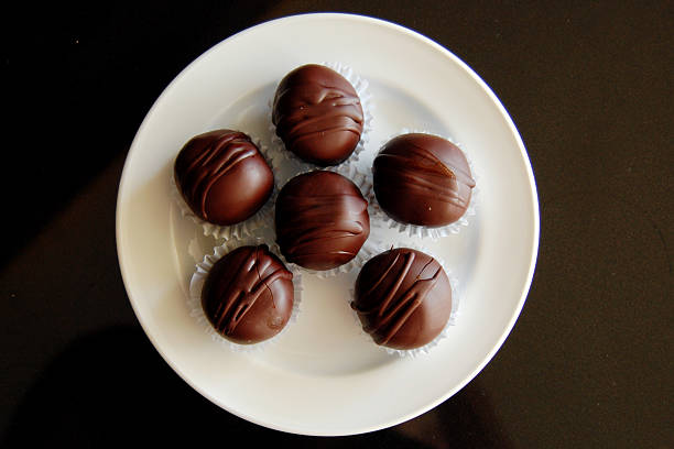 istock Assorted dark chocolate truffles with cocoa powder, 600059786