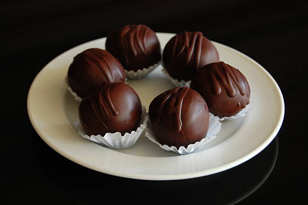 istock Assorted dark chocolate truffles with cocoa powder, 600059854