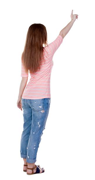 istock Back view of  pointing woman. 600060378