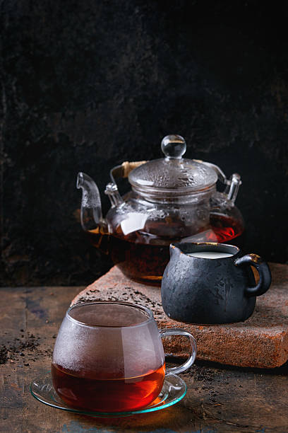 istock Cup of black tea with milk 600060456