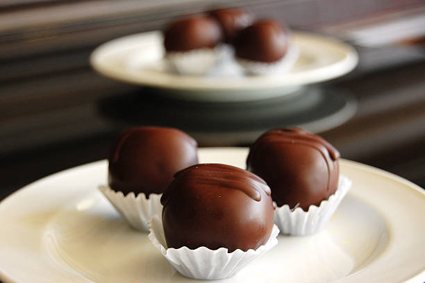 istock Assorted dark chocolate truffles with cocoa powder, 600060756