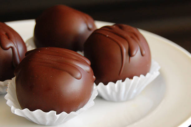 istock Assorted dark chocolate truffles with cocoa powder, 600060842