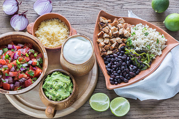 Chicken burrito bowl with the ingredients Chicken burrito bowl with the ingredients mexican culture food mexican cuisine fajita stock pictures, royalty-free photos & images
