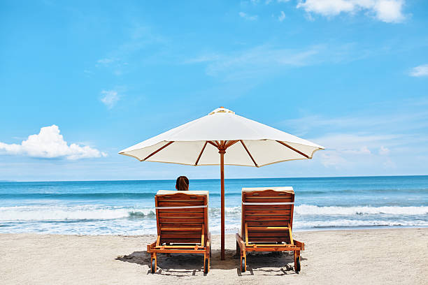 istock Summer Beach. Holidays Vacations. Woman Relaxing, Deck Chairs 600062676