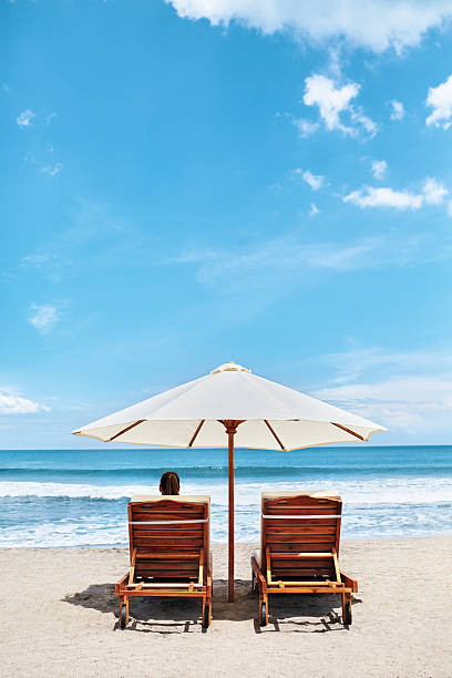 istock Summer Beach. Holidays Vacations. Woman Relaxing, Deck Chairs 600062812