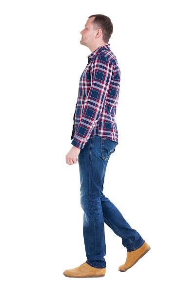 istock Back view of going  handsome man in checkered shirt. 600062846