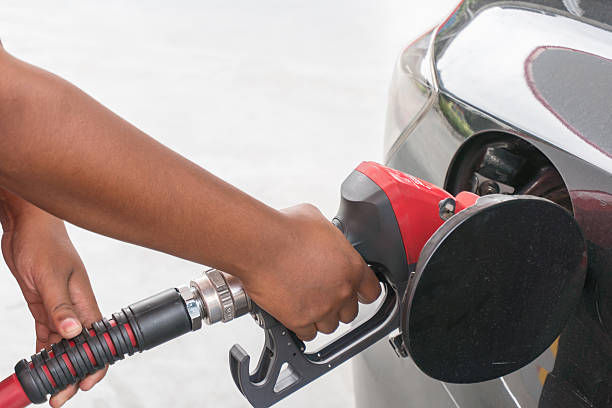 istock Hand refilling the car with fuel. 600064144