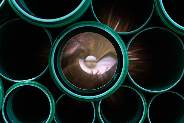 istock Green Abstract Flare Pipes Openings Glow Industrial Tubes 600065422