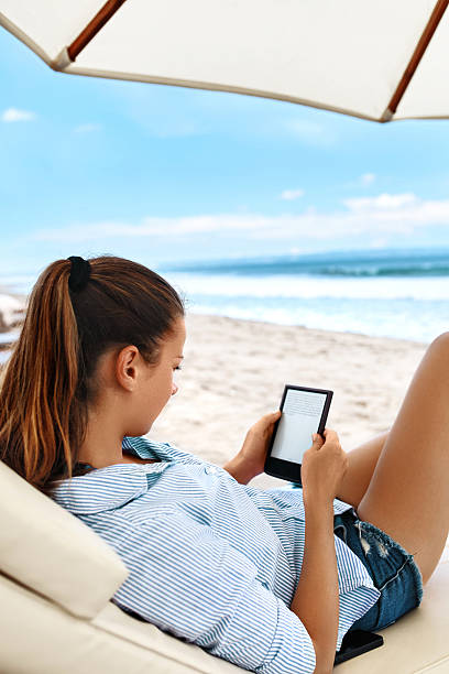 istock Summer Relaxation. Woman Reading, Relaxing On Beach. Summertime 600065914