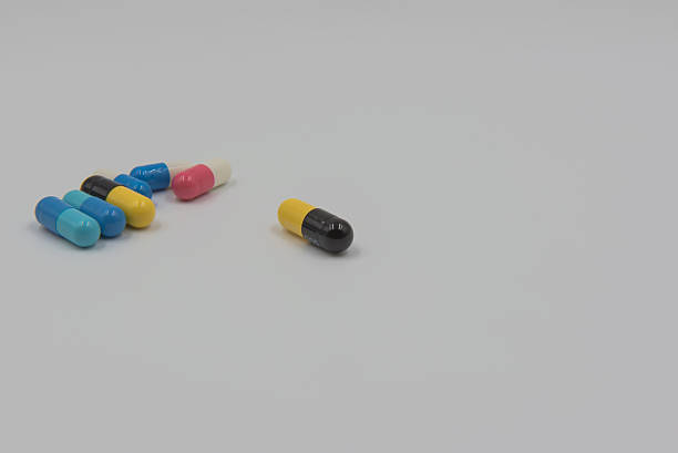 istock Colorful capsule drug on white background 600067302