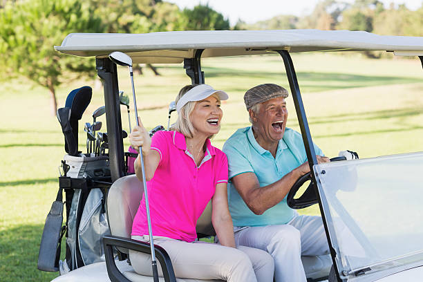 istock Mature couple sitting in golf buggy 600068470