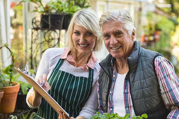 istock Confident gardeners outside greenhouse 600069018