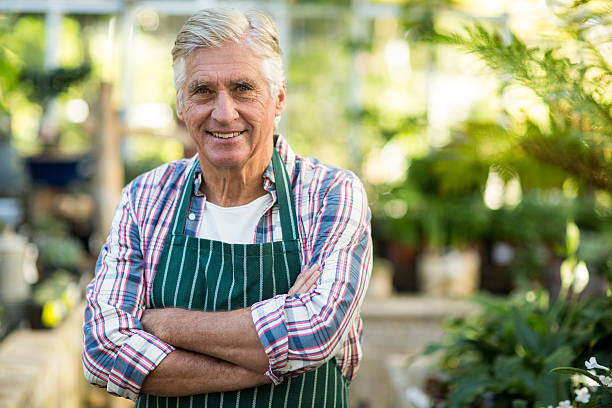 istock Confident male gardener against greenhouse 600069072
