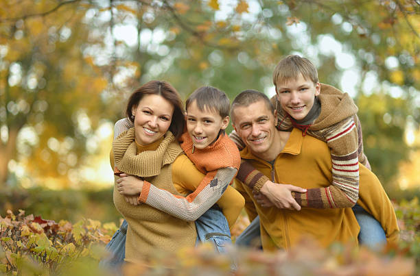 istock Happy family in autumn forest 600071078