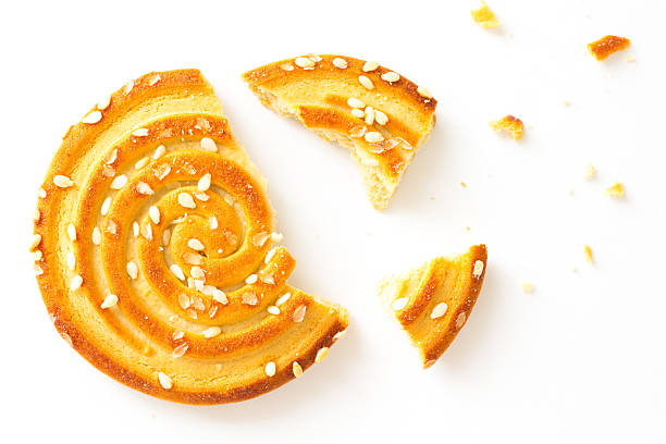 istock Round Cookies with sesame seeds with  bite on white 600071384