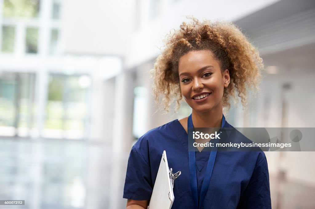 Portrait Of Female Nurse Wearing Scrubs In Hospital Nurse Stock Photo