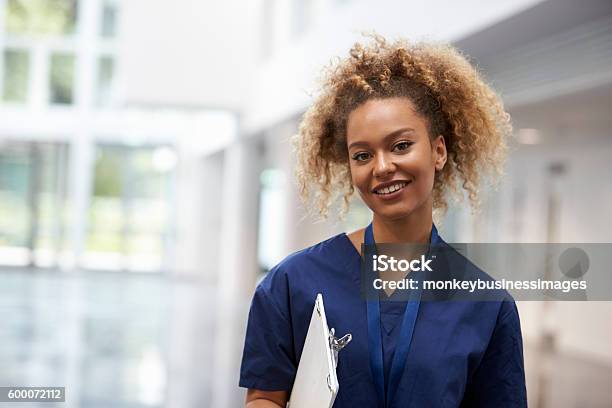 Portrait Of Female Nurse Wearing Scrubs In Hospital Stock Photo - Download Image Now