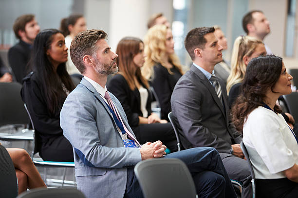 istock Audience Listening To  Speaker At Conference Presentation 600072212