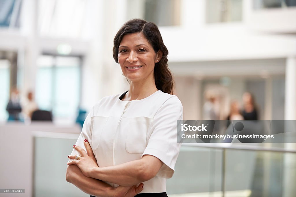 Head And Shoulders Portrait Of Mature Businesswoman Businesswoman Stock Photo