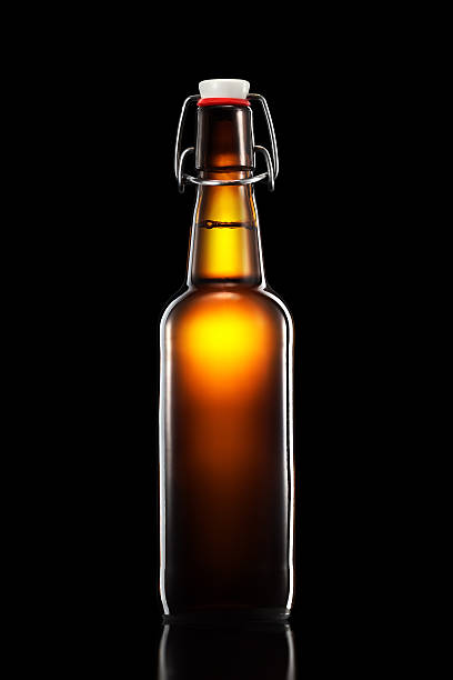 istock Swing top bottle of light beer isolated on black background 600072656
